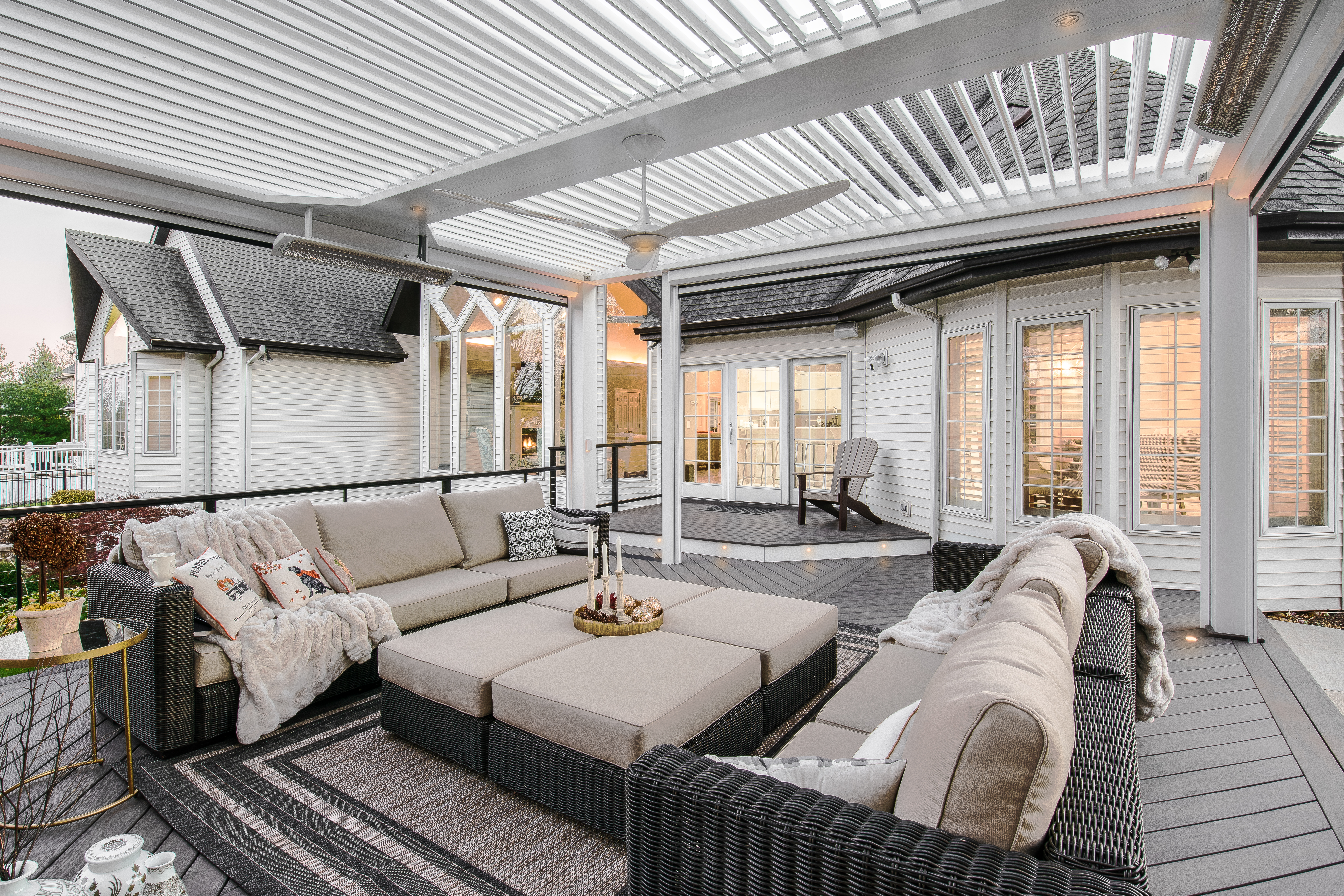 A cozy outdoor space under a pergola, bathed in warm sunlight, inviting relaxation and connection with nature